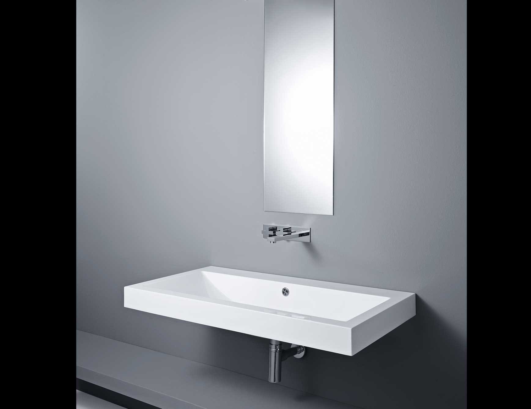 Rectangular white ceramic wall-mounted bathroom sink with chrome faucet